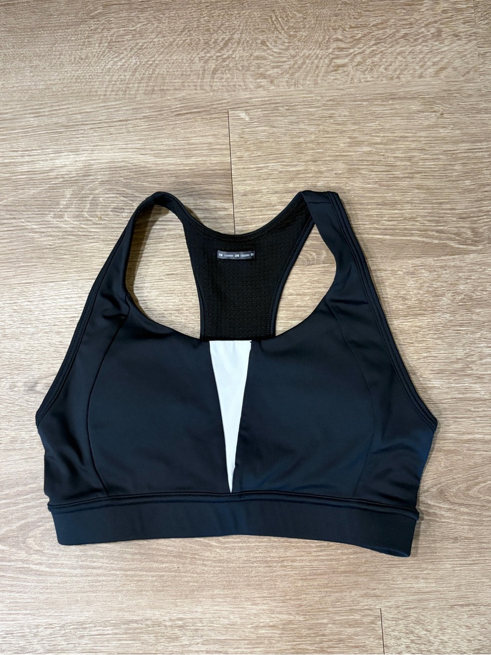 oiselle Black Sports Bra with White Front Panel